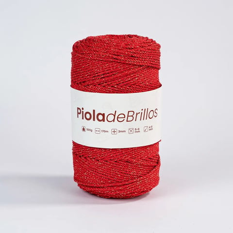Bola de hilo Piola de Brillos rojo con banda de etiqueta blanca sobre fondo claro